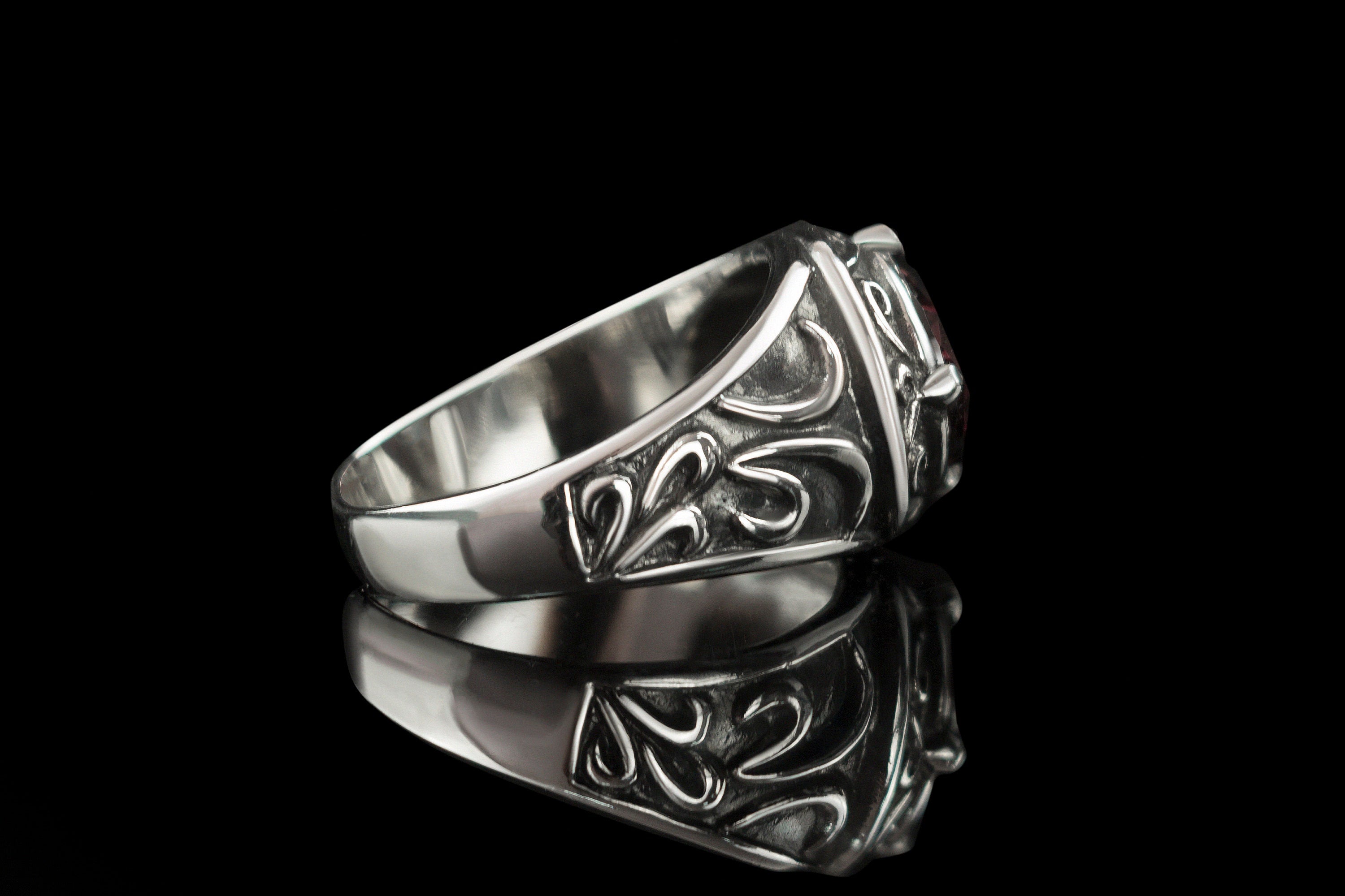 Side profile of the Viking ring showing oxidized Norse knotwork on the shank