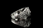 Side profile of the Viking ring showing oxidized Norse knotwork on the shank