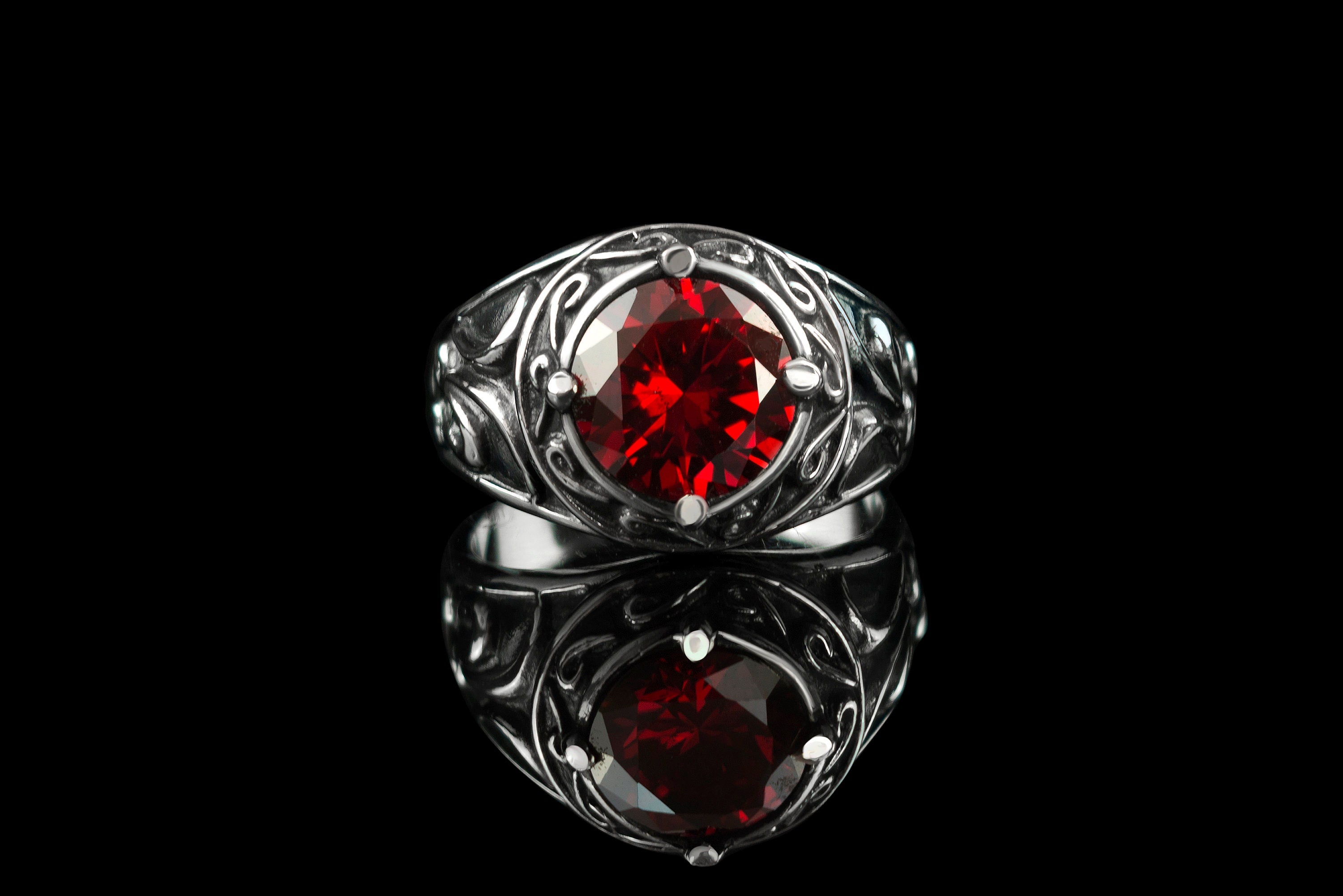 Viking ring front view, faceted red cubic zirconia in a raised bezel