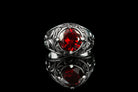 Viking ring front view, faceted red cubic zirconia in a raised bezel