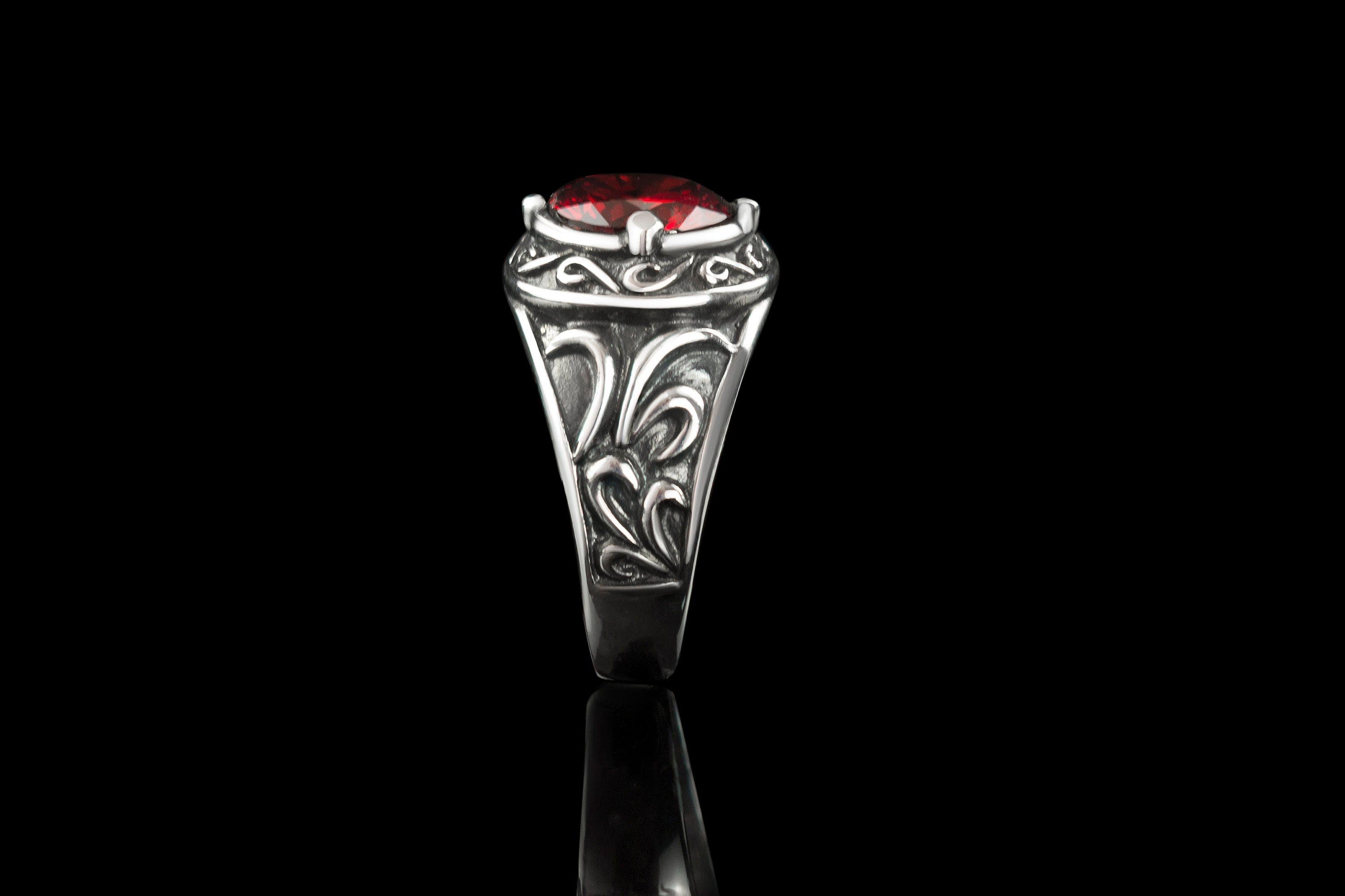 Viking signet ring standing on edge, narrow side view of the band