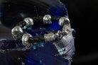 Close-up of silver skulls and end caps on the Wild leather bracelet