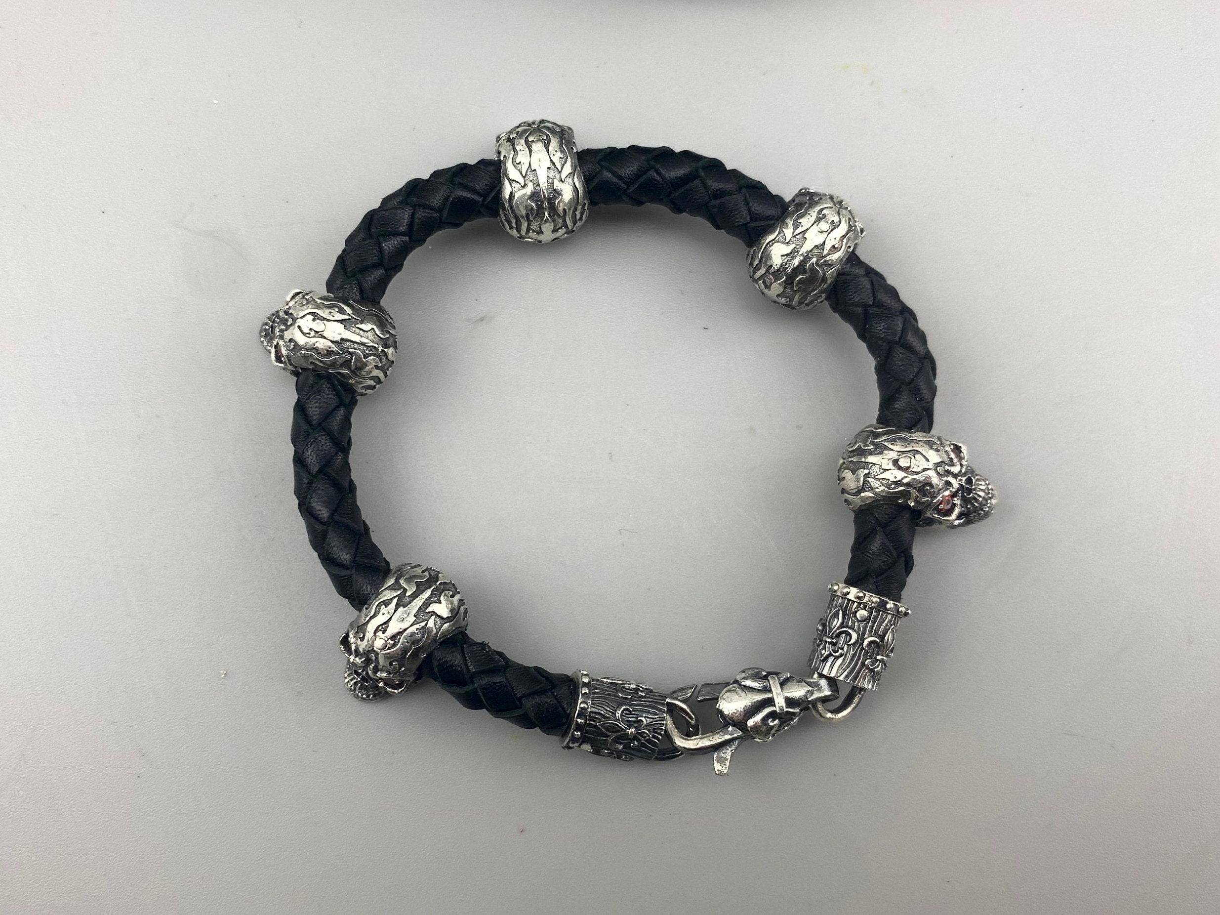 Wild leather bracelet from above with silver skulls and beads
