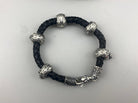 Wild leather bracelet from above with silver skulls and beads