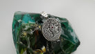 Yggdrasil silver pendant front with red cubic zirconia at the center