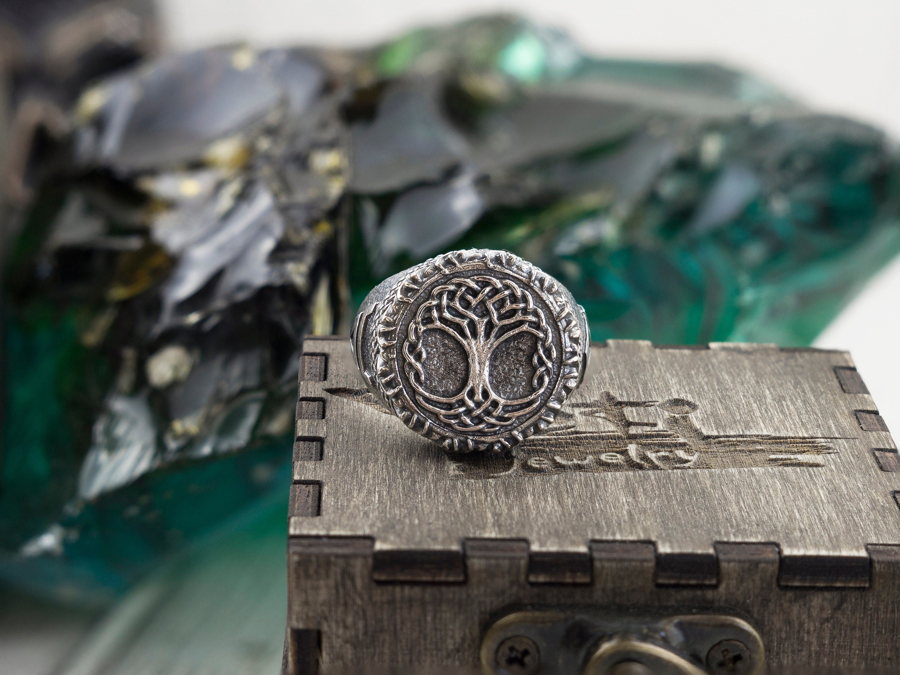 Yggdrasil ring on a wooden box, front view of the Tree of Life