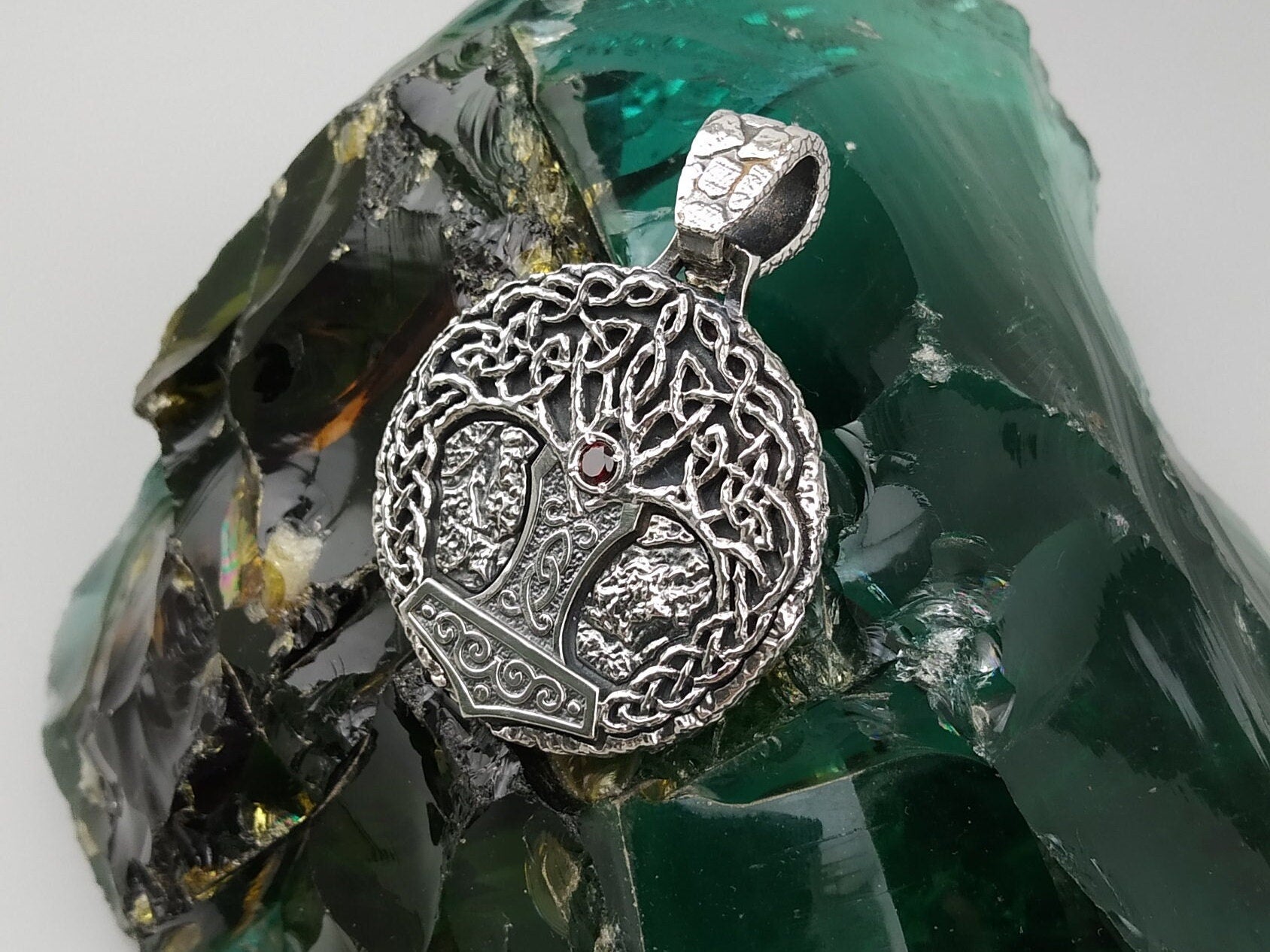 Close-up of the Yggdrasil pendant with Celtic knotwork branches and heavy bail