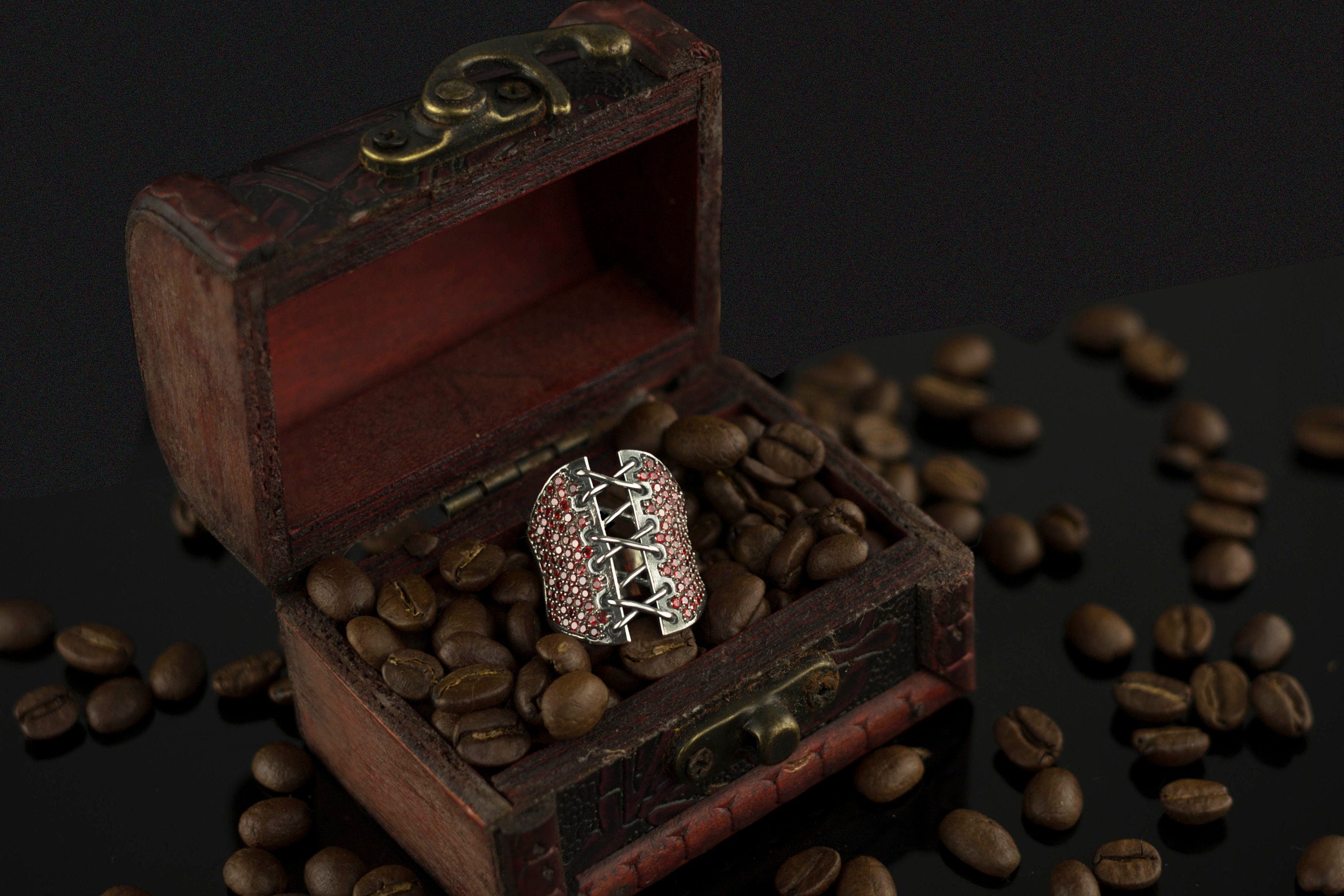 Corset Ring with red gemstones