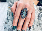 Long sterling silver armor ring covering the finger, side view on hand